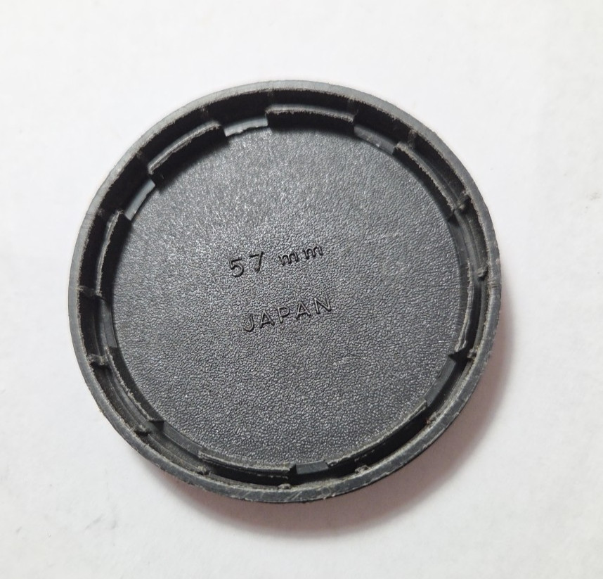 Minolta 57mm plastic push-on front lens cap / #724