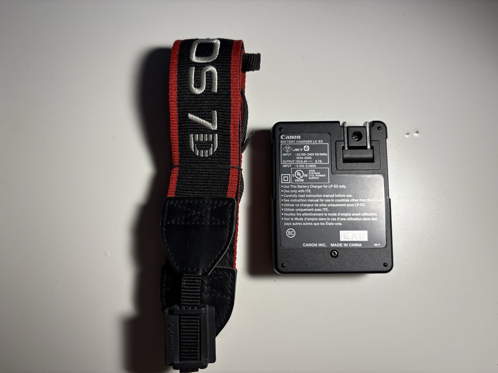 Canon Rebel XSI DSLR Camera With Battery Grip BG-E5, Strap, Charger, Body Cap.