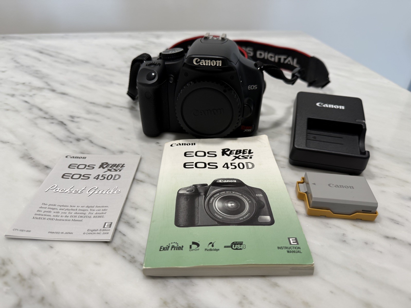 CANON EOS Rebel xsi 450D (body only), w/ manual, Canon battery and charger