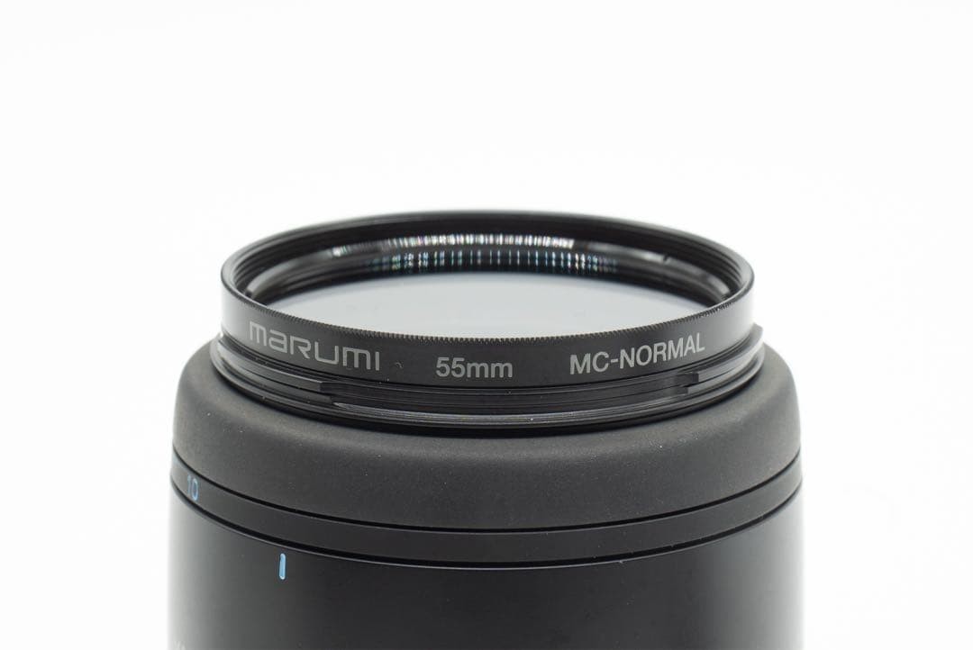 1-Month Warranty. Minolta 100 F2.8 Macro Lens. Functionality Checked.