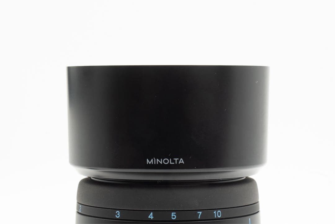 1-Month Warranty. Minolta 100 F2.8 Macro Lens. Functionality Checked.