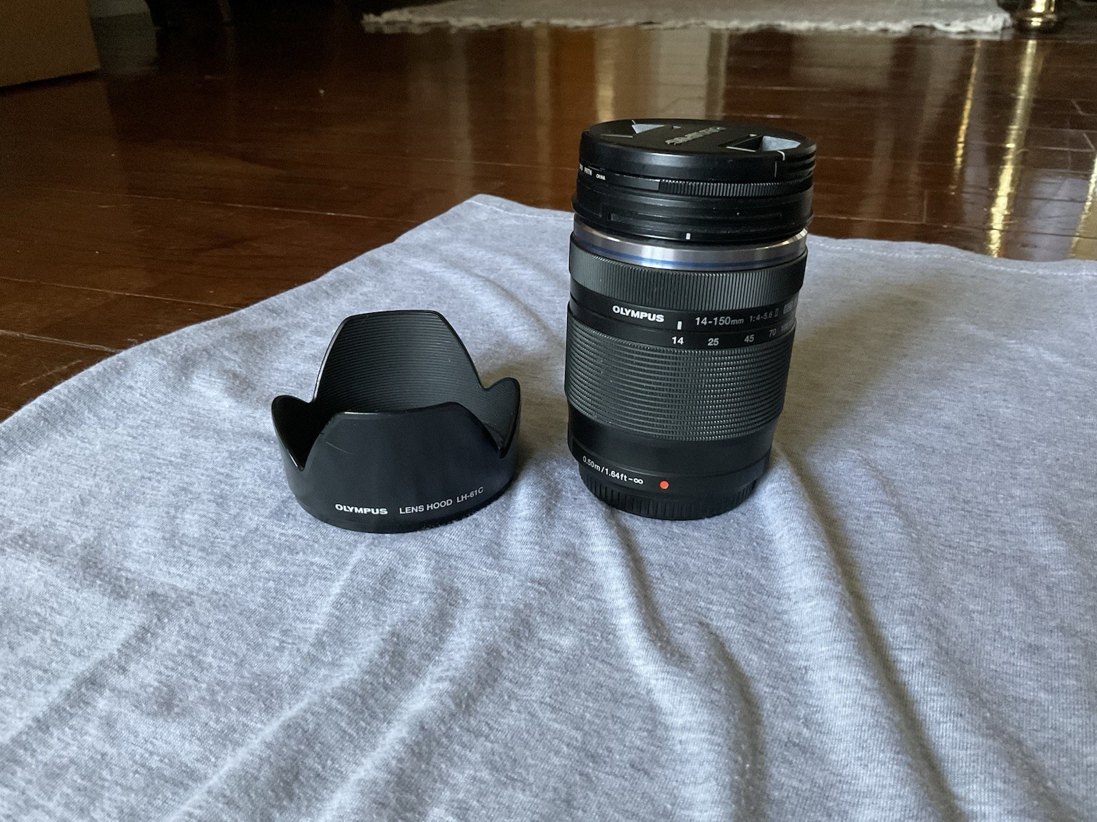 Olympus M.Zuiko 14-150mm f/4-5.6 II Lens w/ Hood & ProMaster Filter – Good
