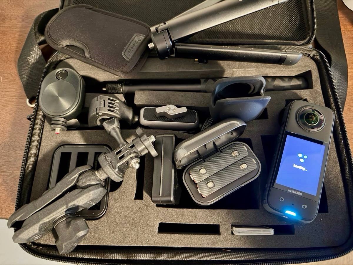 Insta360 X3 with case, 3 batteries and charger, selfie stick, tripod, etc.