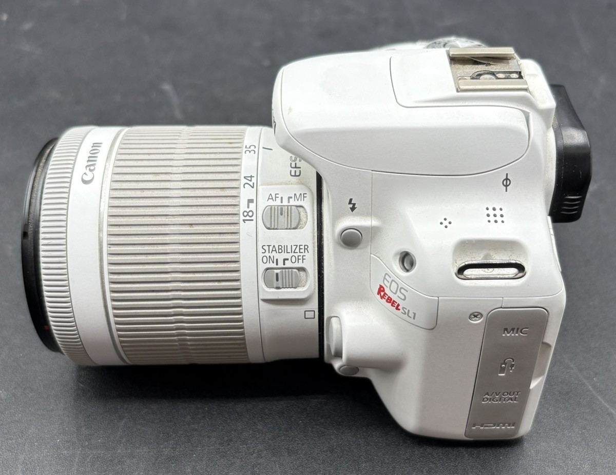 CANON EOS REBEL SL1 18.0MP DIGITAL SLR CAMERA WHITE W/ 18-55MM LENS (MVP039628)
