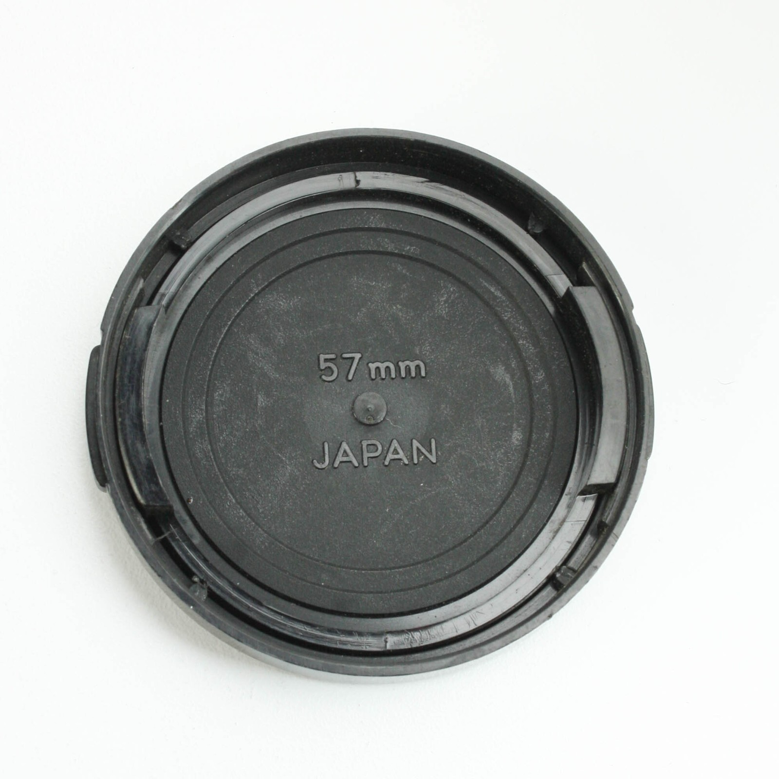 Minolta 57mm – Black Plastic Snap-On Front Lens Cap – Japan