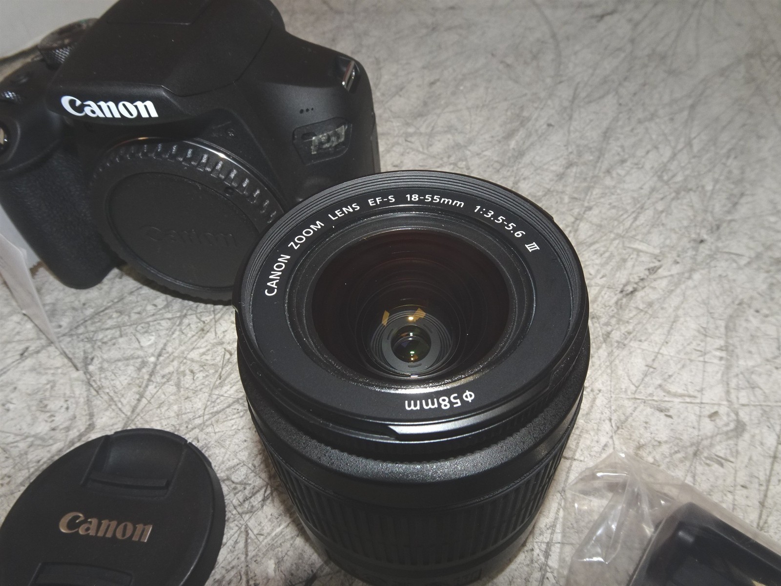 Canon EOS Rebel T7 DSLR 24.1MP w/ EF-S 18-55mm III Lens and Battery