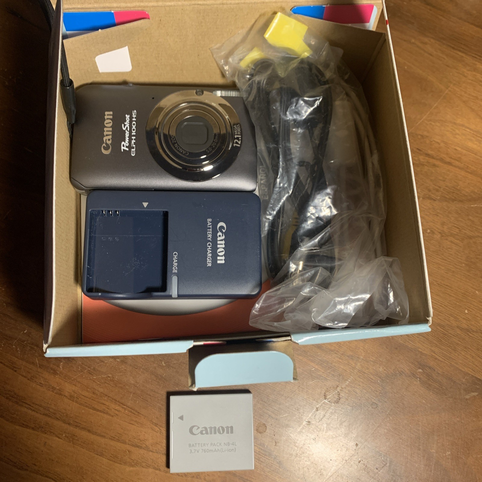 Canon PowerShot ELPH 100HS 12.1 MP 4x Zoom Gray PC1588, Comes W/ 2 Batteries