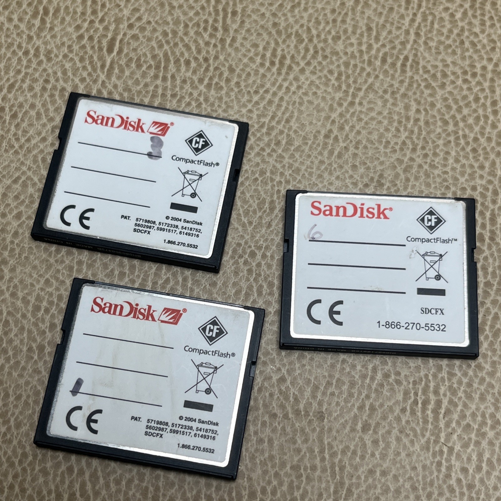 2 Sandisk 4GB Extreme IV Compact Flash Cards + 1 Extreme 8GB