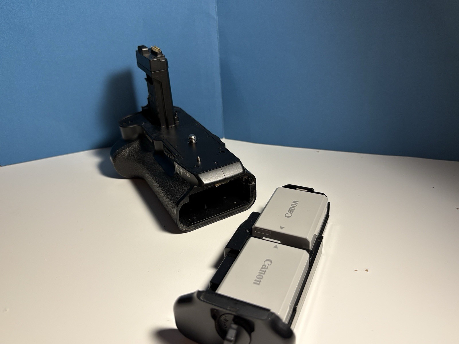 Canon Rebel XSI DSLR Camera With Battery Grip BG-E5, Strap, Charger, Body Cap.