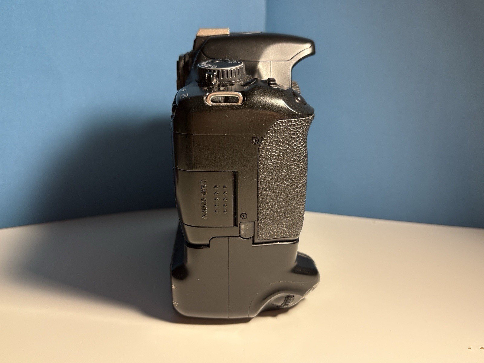 Canon Rebel XSI DSLR Camera With Battery Grip BG-E5, Strap, Charger, Body Cap.