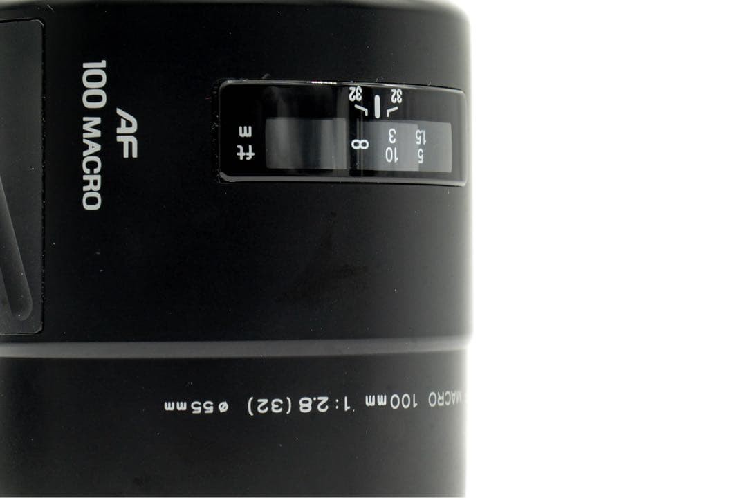 1-Month Warranty. Minolta 100 F2.8 Macro Lens. Functionality Checked.
