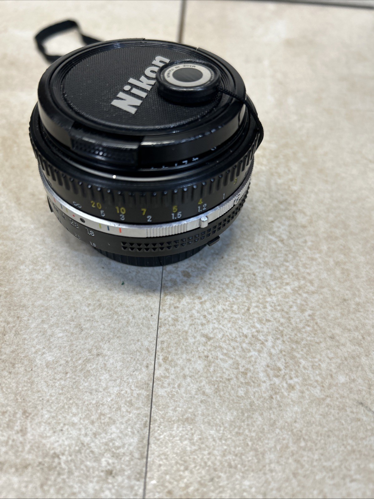 Nikon Nikkor 50mm F1-1.8 lens W/lanyard Made In JAPAN
