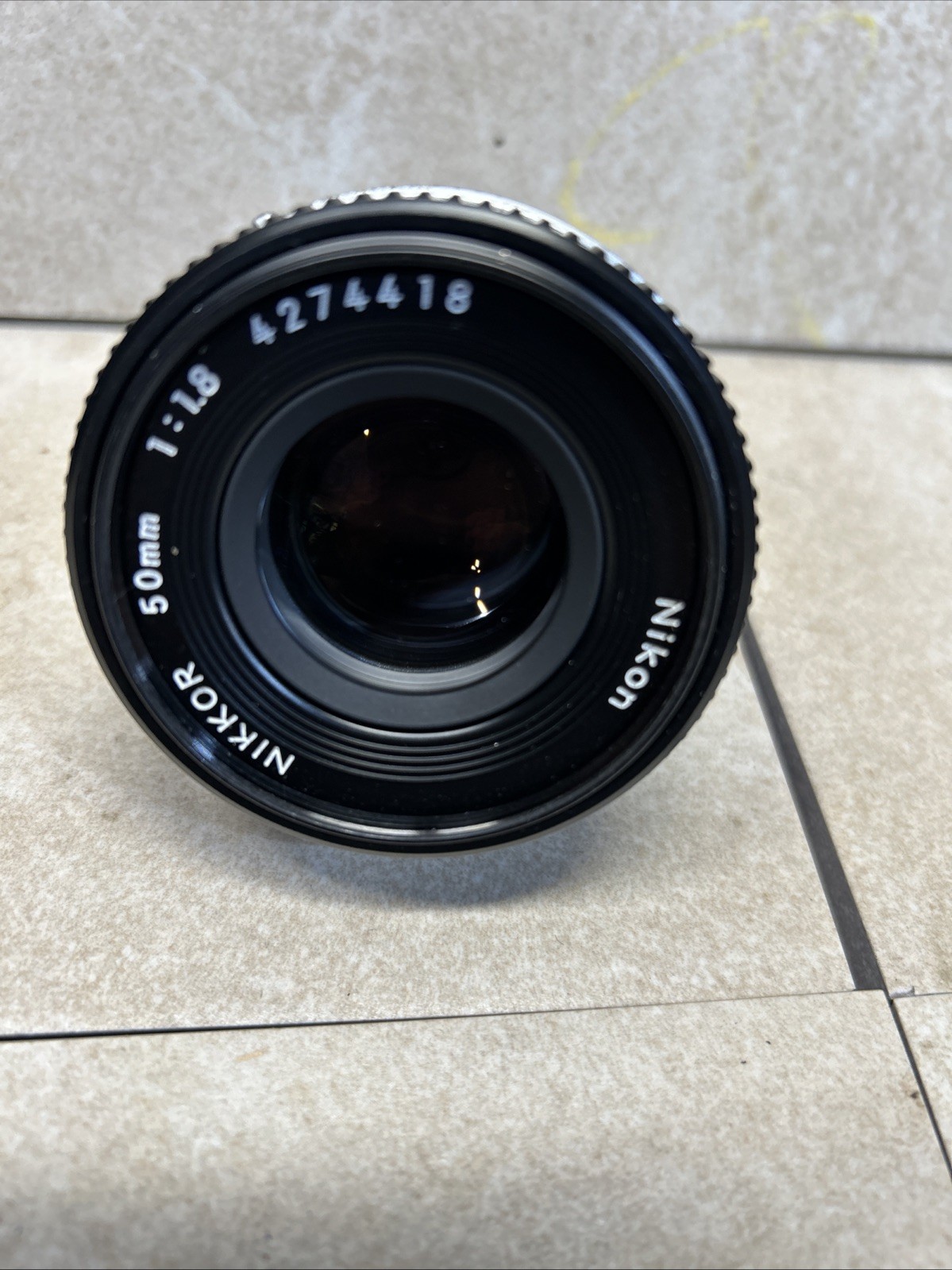 Nikon Nikkor 50mm F1-1.8 lens W/lanyard Made In JAPAN