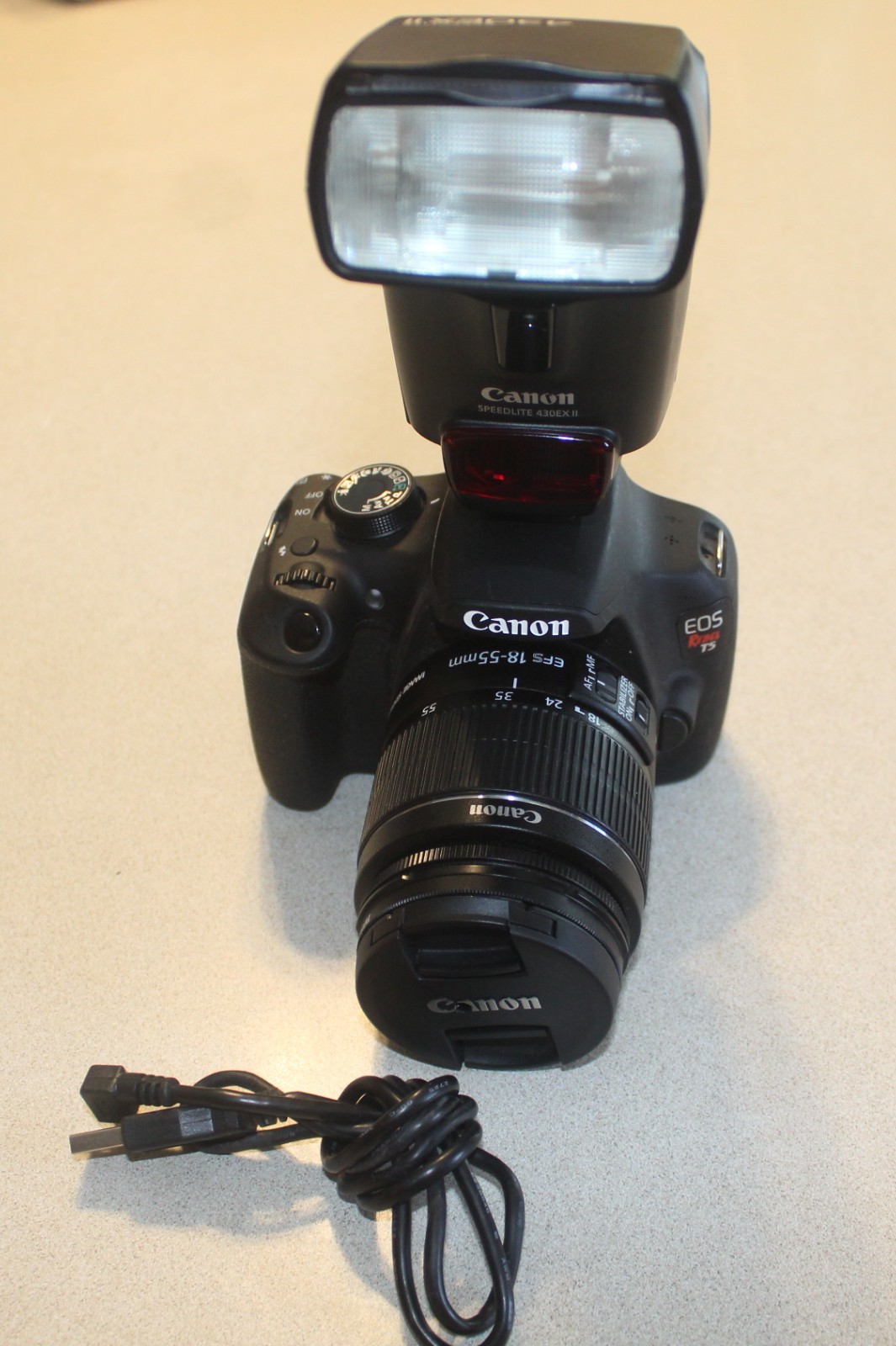Canon EOS Rebel T5 DSLR Digital Camera 18-55mm Lens, Filter, Battery and Flash