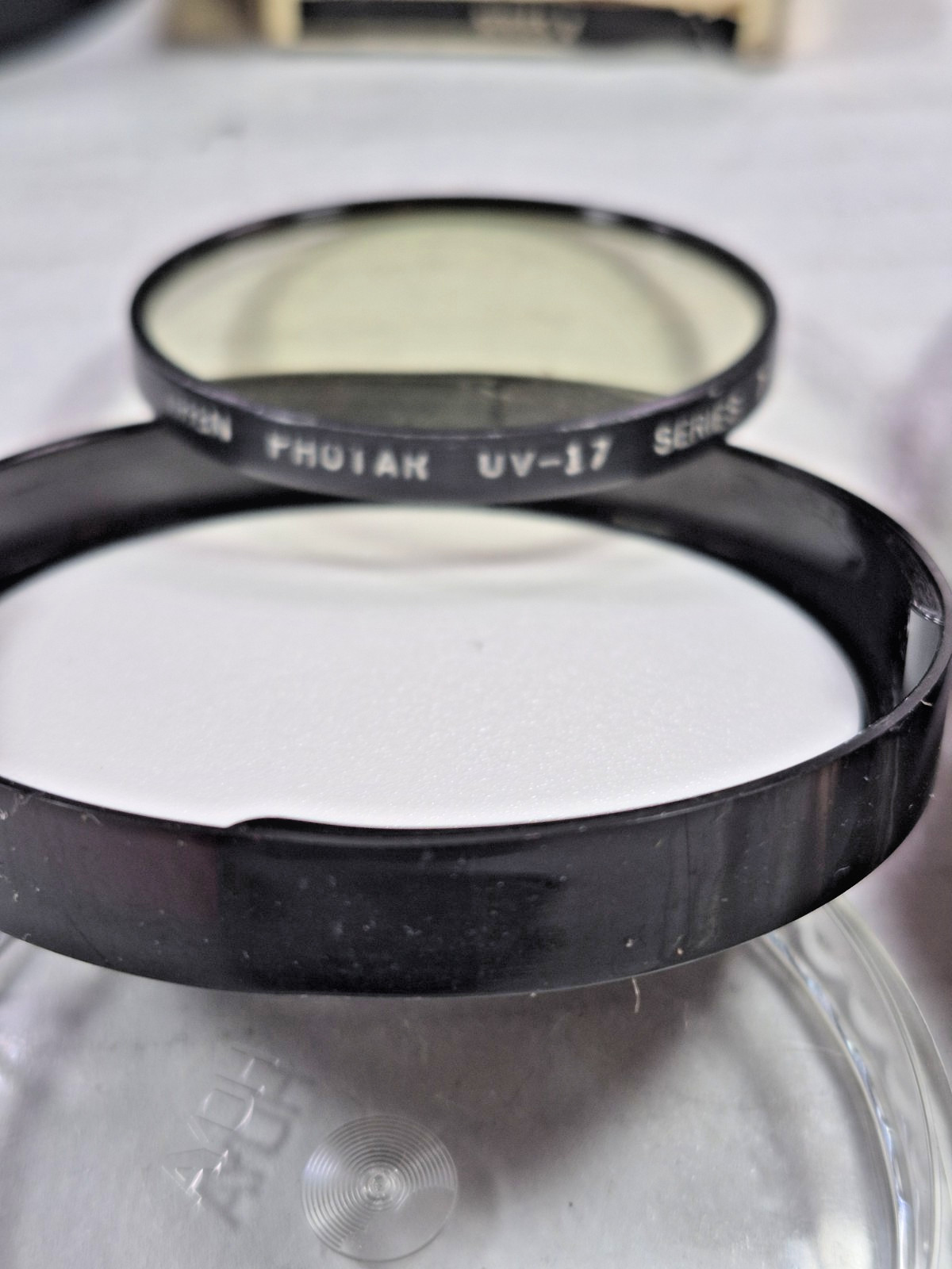 Miscellaneous used camera lens, filters, and empty cases plus misc. others