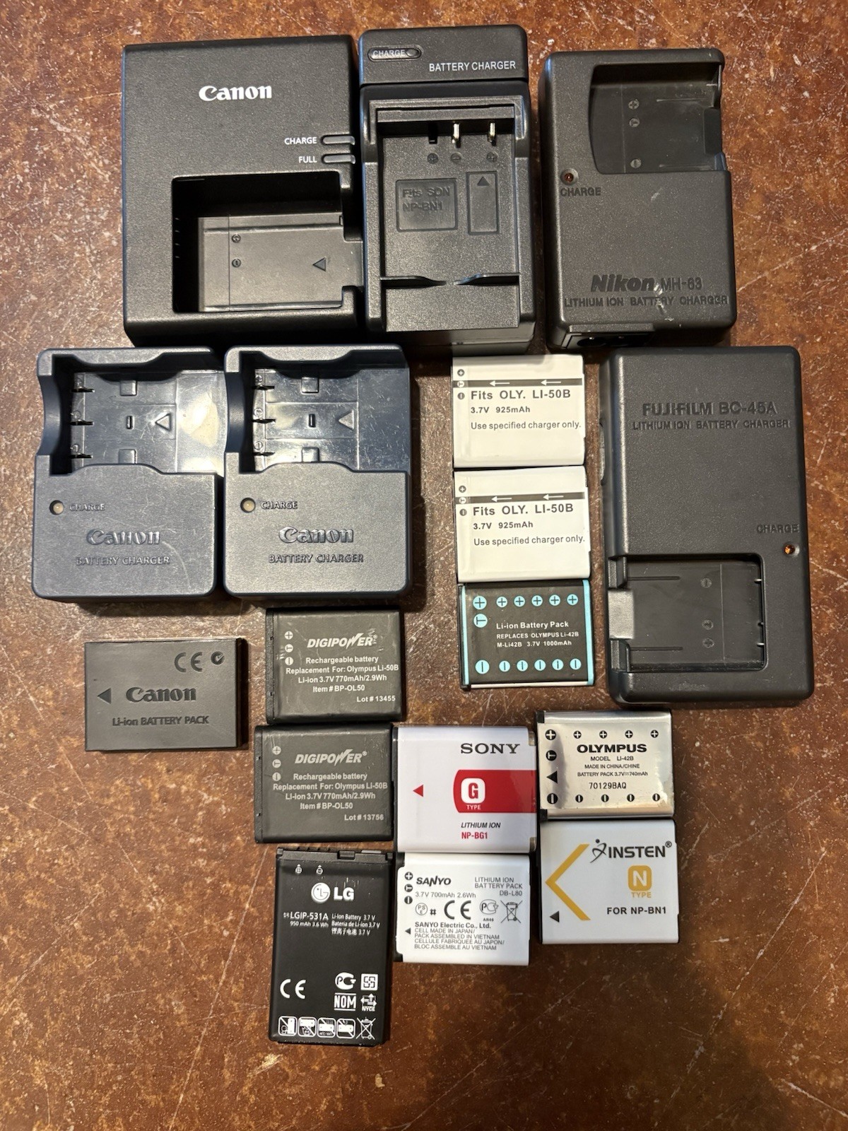 Lot Of 6 Different Camera Chargers And 11 Battery’s (Untested)