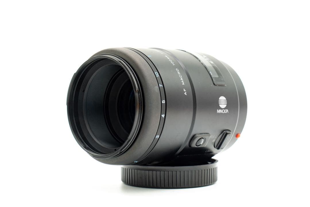 1-Month Warranty. Minolta 100 F2.8 Macro Lens. Functionality Checked.